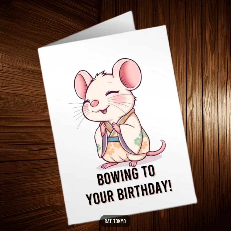 Funny Free Printable Birthday Card: A cheerful rat in a decorated kimono bows with a happy expression.